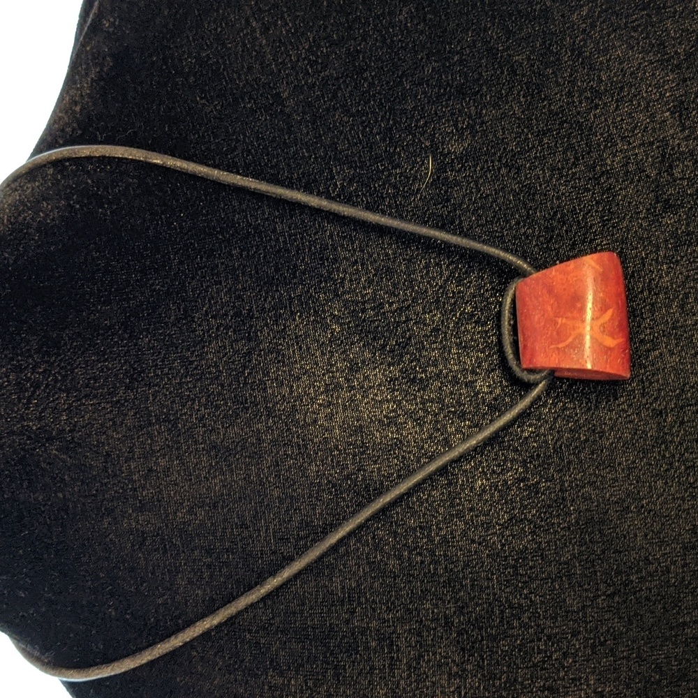 Red stone on leather necklace